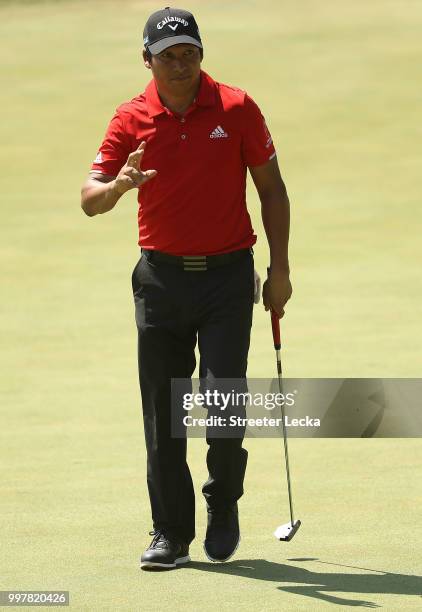 Andres Romero of Argentina reacts after making a putt on the 18th hole during the second round of the John Deere Classic at TPC Deere Run on July 13,...