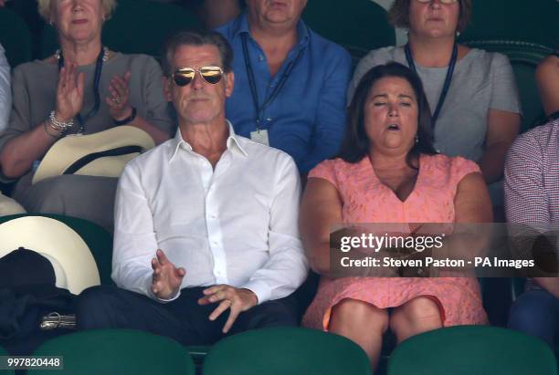 Pierce Brosnan and Keely Shaye Smith in the stands on day eleven of the Wimbledon Championships at the All England Lawn Tennis and Croquet Club,...