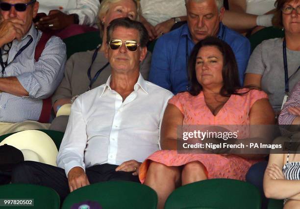 Pierce Brosnan and Keely Shaye Smith in the stands on day eleven of the Wimbledon Championships at the All England Lawn Tennis and Croquet Club,...