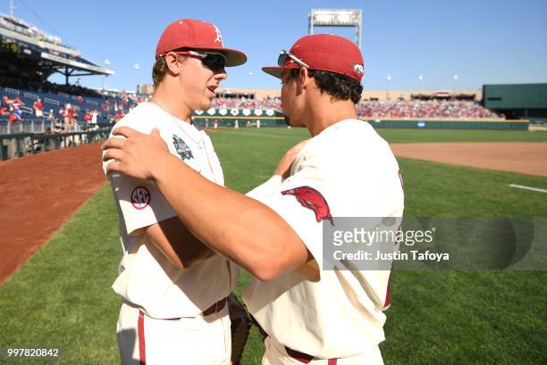 Eric Cole and Dominic Fletcher of the Arkansas Razorbacks talk before they take on the Oregon State Beavers during the Division I Men's Baseball...