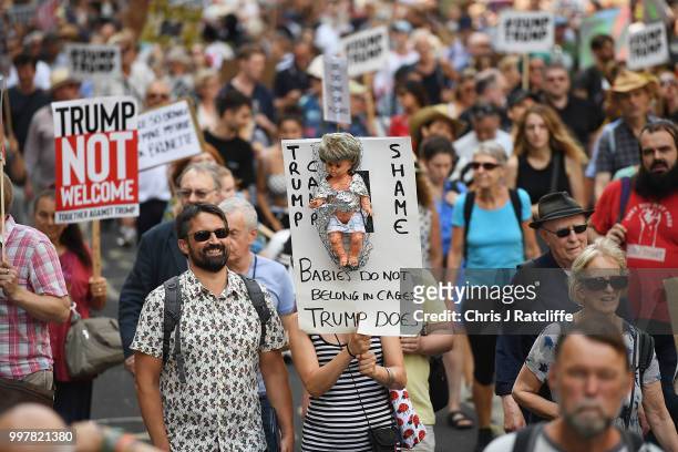 Protesters take part in a demonstration against President Trump's visit to the UK on July 13, 2018 in London, England. Tens of Thousands Of...