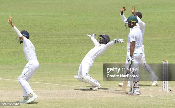 Sri Lankan wicketkeeper Niroshan Dickwella and Angelo Mathews appeal successfully for the dismissal of South African cricketer Vernon Philander...