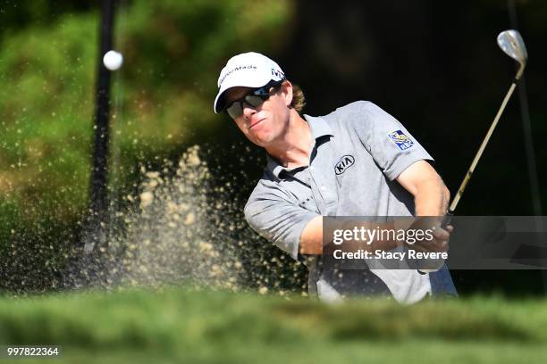 David Hearn of Canada hits from a green side bunker on the ninth hole during the second round of the John Deere Classic at TPC Deere Run on July 13,...