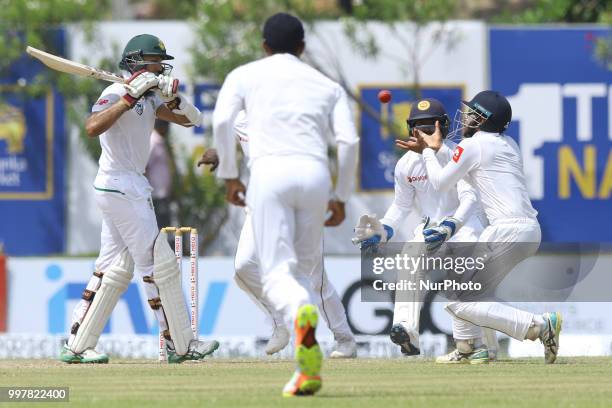 South African cricketer Hashim Amla looks on as Sri Lankan cricketer Kusal Mendis completes a catch to claim the dismissal during the 2nd day's play...