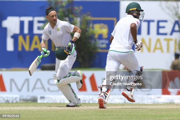 South African cricket captain Faf Du Plessis and Vernon Philander run between the wickets during the 2nd day's play in the first Test cricket match...