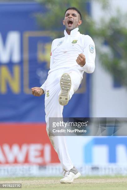 South African cricketer Keshav Maharaj celebrates after taking a wicket during the 2nd day's play in the first Test cricket match between Sri Lanka...