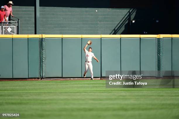 Dominic Fletcher of the Arkansas Razorbacks catches a fly ball against the Oregon State Beavers during the Division I Men's Baseball Championship...
