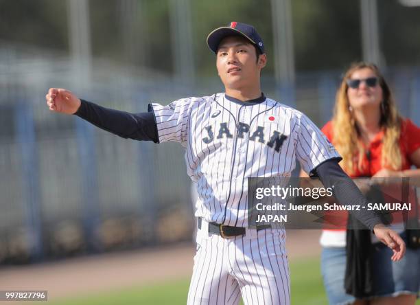 Hiromi Ito of Japan throws a ball into the audience when being elected player of the match after the Haarlem Baseball Week match between Japan and...