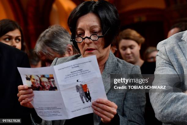 German writer and Nobel laureate Herta Mueller reads the program at a commemoration for late Chinese dissident and Nobel Peace Prize laureate Liu...