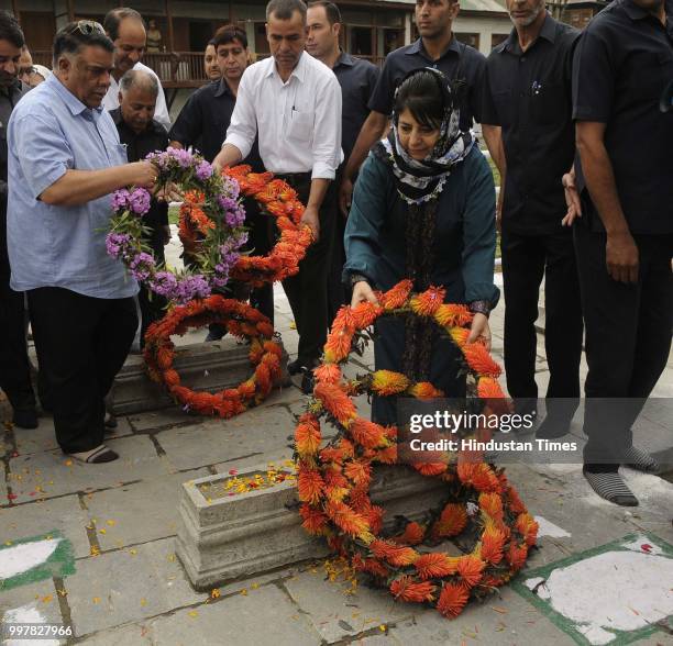 Former Chief Minister of Jammu and Kashmir Mehbooba Mufti offer floral tribute to 1931 martyrs during a ceremony to mark Martyrs Day at...