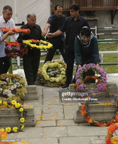 Former Chief Minister of Jammu and Kashmir Mehbooba Mufti offer floral tribute to 1931 martyrs during a ceremony to mark Martyrs Day at...