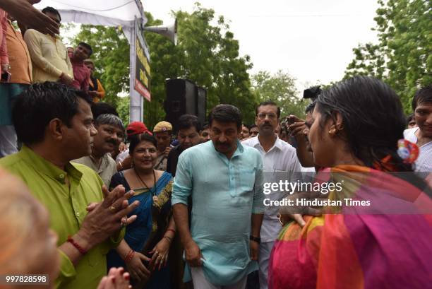 Delhi BJP president Manoj Tiwari with party workers and supporters during the protest against the water-power breakdown in the city and corruption...