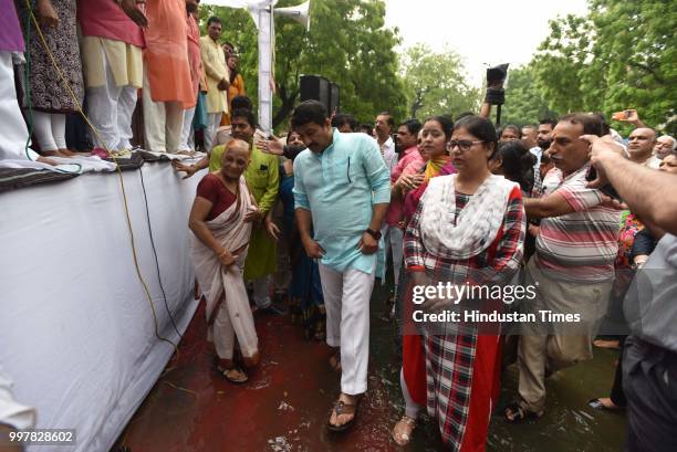 Delhi BJP president Manoj Tiwari with party workers and supporters during the protest against the water-power breakdown in the city and corruption...