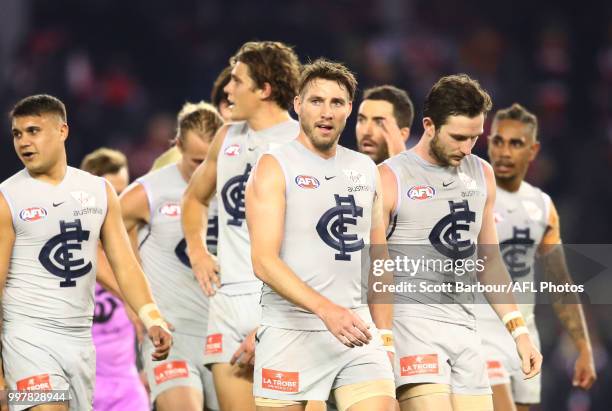 Dale Thomas of the Blues and the Blues leave the field at half time during the round 17 AFL match between the St Kilda Saints and the Carlton Blues...