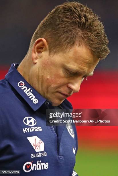 Blues head coach Brendon Bolton speaks to his team during a quarter time break during the round 17 AFL match between the St Kilda Saints and the...