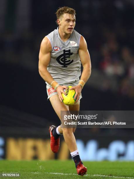 Patrick Cripps of the Blues runs with the ball during the round 17 AFL match between the St Kilda Saints and the Carlton Blues at Etihad Stadium on...