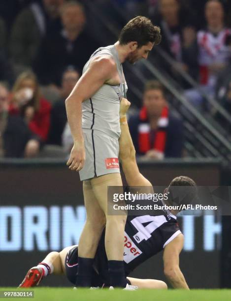 Jed Lamb of the Blues and Jade Gresham of the Saints wrestle in the second quarter during the round 17 AFL match between the St Kilda Saints and the...