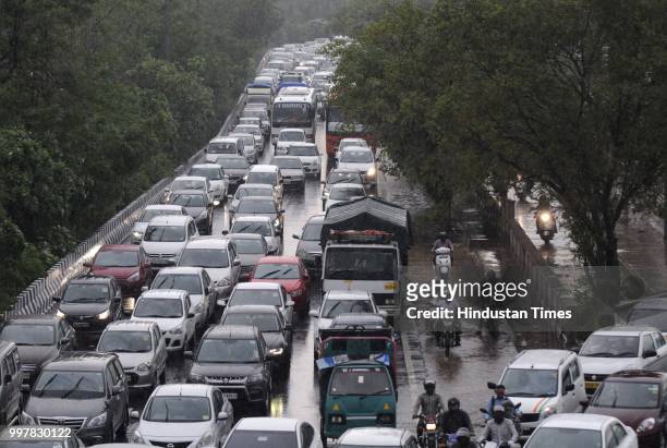 Traffic jam at DND road due to heavy rain, on July 13, 2018 in Noida, India. The heavy rains came as a respite to the people of Delhi-NCR after a day...