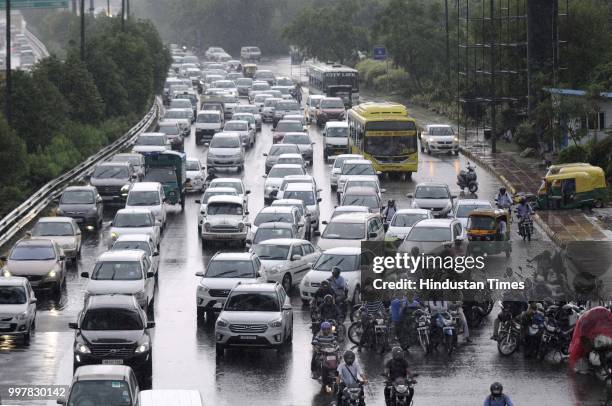 Traffic jam at Noida expressway due to heavy rain, on July 13, 2018 in Noida, India. The heavy rains came as a respite to the people of Delhi-NCR...