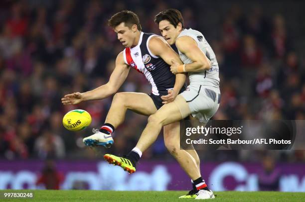 Jack Steele of the Saints is tackled by Zac Fisher of the Blues during the round 17 AFL match between the St Kilda Saints and the Carlton Blues at...