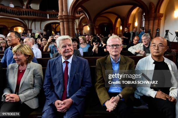 Chinese exiled writer Liao Yiwu, Pulitzer Prize-winning author and journalist Ian Johnson, former German President Joachim Gauck and his partner...