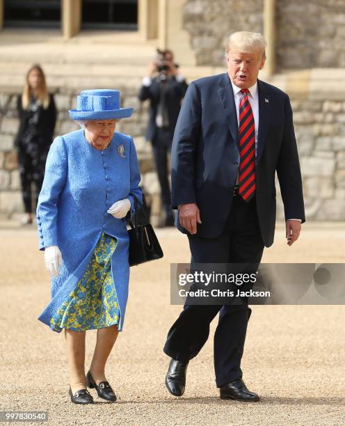 Queen Elizabeth II and President of the United States, Donald Trump inspect a n honour guard at Windsor Castle on July 13, 2018 in Windsor, England....