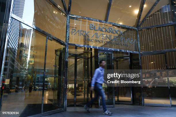 Pedestrian exits BlackRock Park Avenue Plaza in New York, U.S, on Wednesday, June 11, 2018. BlackRock Inc. Is scheduled to release earnings figures...