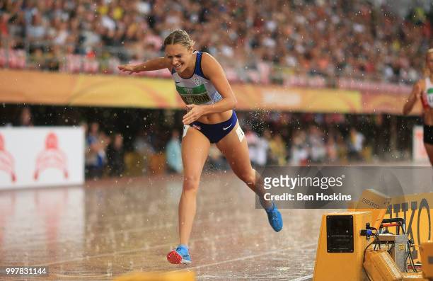 Niamh Emerson of Great Britain crosses the finish line in the 800m to win gold in the women's decathlon during the women's heptahlon javelin on day...