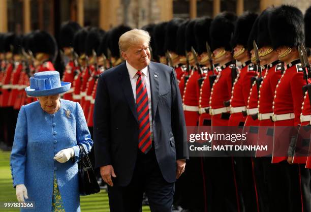 Britain's Queen Elizabeth II and US President Donald Trump inspect the guard of honour formed of the Coldstream Guards during a welcome ceremony at...