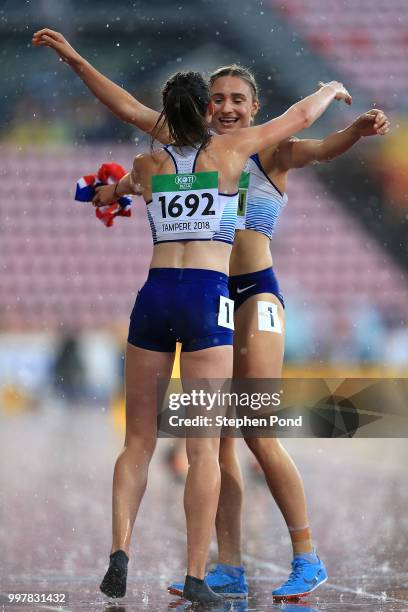 Niamh Emerson of Great Britain celebrates with team mate Jade O'Dowda after winning gold in the women's decathlon during the women's heptahlon...