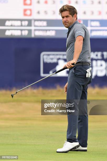 Robert Rock of England reacts to his par putt on hole eighteen during day two of the Aberdeen Standard Investments Scottish Open at Gullane Golf...