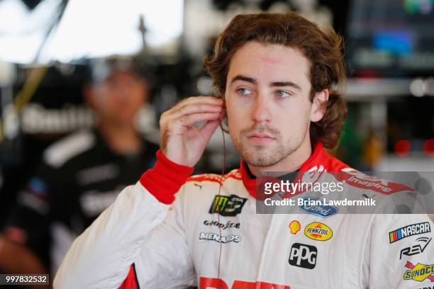 Ryan Blaney, driver of the DEX Imaging Ford, stands in the garage area during practice for the Monster Energy NASCAR Cup Series Quaker State 400...