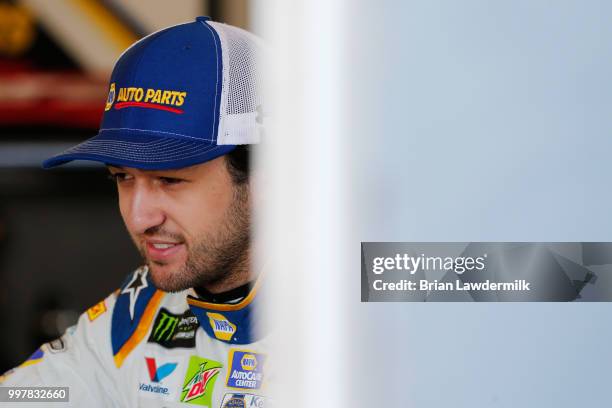 Chase Elliott, driver of the NAPA Auto Parts Chevrolet, stands in the garage area during practice for the Monster Energy NASCAR Cup Series Quaker...