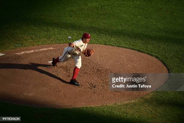 Jake Reindl of the Arkansas Razorbacks delivers a pitch against the Oregon State Beavers during the Division I Men's Baseball Championship held at TD...