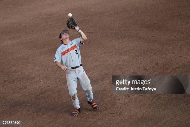Cadyn Grenier of the Oregon State Beavers catches a fly ball against the Arkansas Razorbacks during the Division I Men's Baseball Championship held...