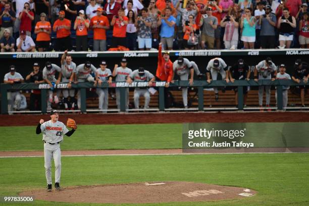 Kevin Abel of the Oregon State Beavers celebrates the final out to win the national title against the Arkansas Razorbacks during the Division I Men's...