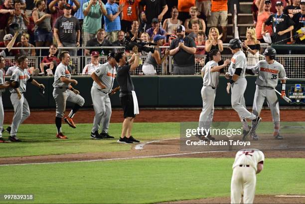 Trevor Larnach of the Oregon State Beavers celebrates his two run home run to take the lead against the Arkansas Razorbacks during the Division I...