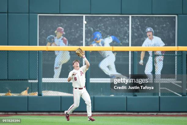 Eric Cole of the Arkansas Razorbacks catches a fly ball against the Oregon State Beavers during the Division I Men's Baseball Championship held at TD...