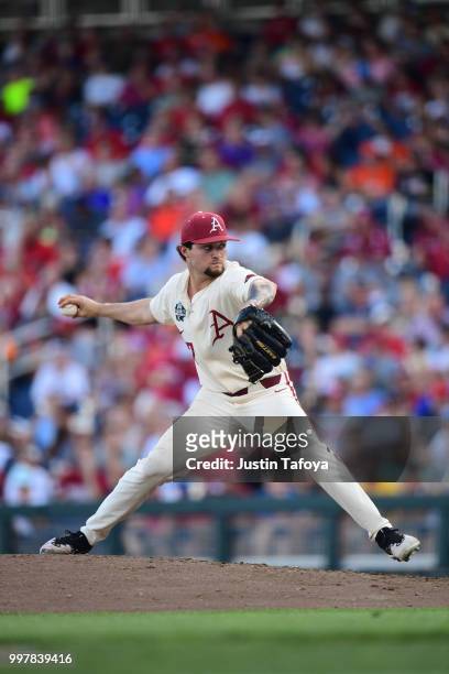 Cody Scroggins of the Arkansas Razorbacks delivers a pitch against the Oregon State Beavers during the Division I Men's Baseball Championship held at...