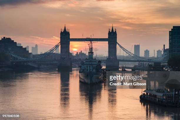 golden autumn sunrise over tower bridge in london. - bascule bridge stock pictures, royalty-free photos & images