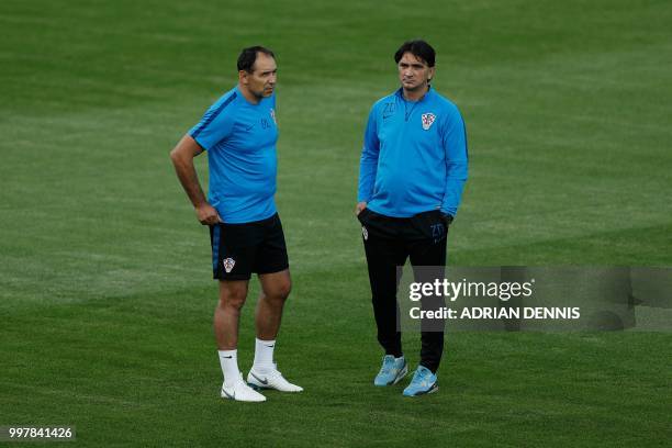 Croatia's coach Zlatko Dalic and assistant coach Drazen Ladic attend a training session of the Croatian national football team at a training field...