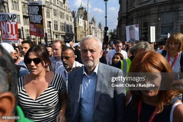 Labour Party leader Jeremy Corbyn walks through a demonstration against President Trump's visit to the UK on his way to make a speech in Trafalgar...
