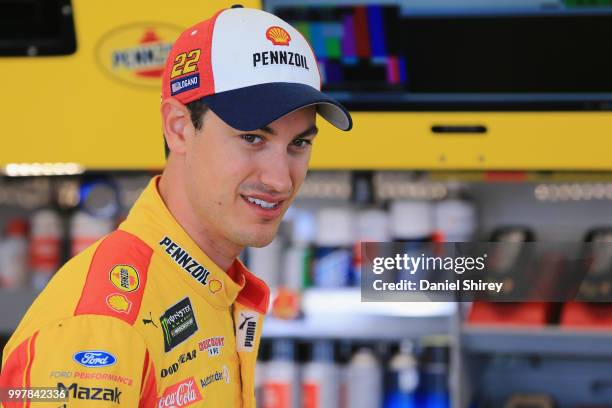 Joey Logano, driver of the Shell Pennzoil Ford, stands in the garage area during practice for the Monster Energy NASCAR Cup Series Quaker State 400...