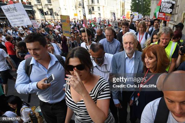Labour Party leader Jeremy Corbyn walks through a demonstration against President Trump's visit to the UK on his way to make a speech in Trafalgar...