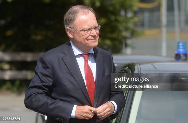 The Premier of Lower Saxony, Stephan Weil, buttoning his jacket as he arrives to the State Chancellery in Hanover, Germany, 04 August 2017. After the...