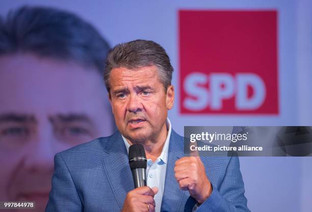 German Foreign Minister Sigmar Gabriel speaking to spectators during the kick-off of his campaign ahead of the Bundestag elections in Salzgitter,...