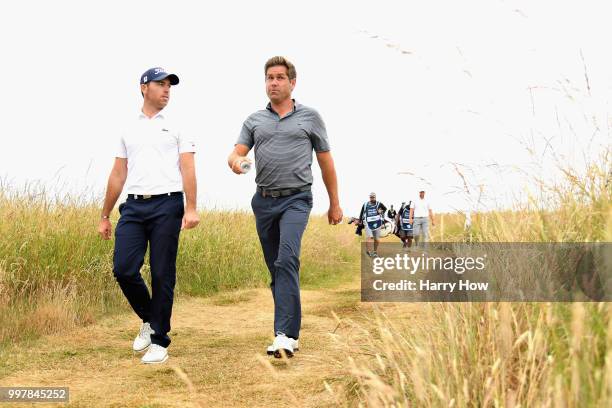 Robert Rock of England and Julien Guerrier of France walk from the tee on hole eighteen during day two of the Aberdeen Standard Investments Scottish...