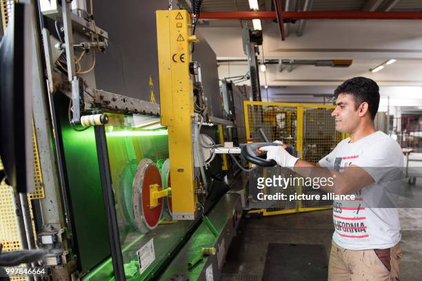 Golagha Ahmad Zai from Afghanistan in the workshops of Energy Glas in Wolfshagen, Germany, 4 August 2017. The glass manufacturer is running a work...
