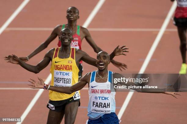 Mohammed "Mo" Farah from Great Britain celebrates his victory at the 10,000 meter run at the finish line ahead of Joshua Kiprui Cheptegei from Uganda...