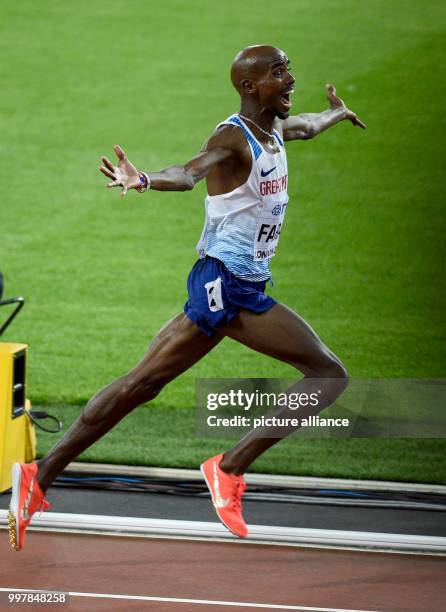 Mohammed "Mo" Farah from Great Britain celebrates his victory at the 10,000 meter run at the 2017 London World Championships in Athletics at the...